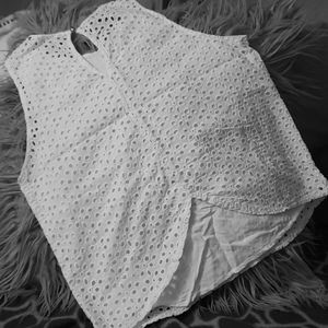 White sleeveless eyelet top